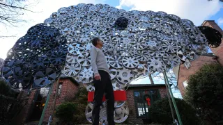 Baltimore Cyclist Finds Joy in Collecting Lost Hubcaps and Stringing Them Into Art
